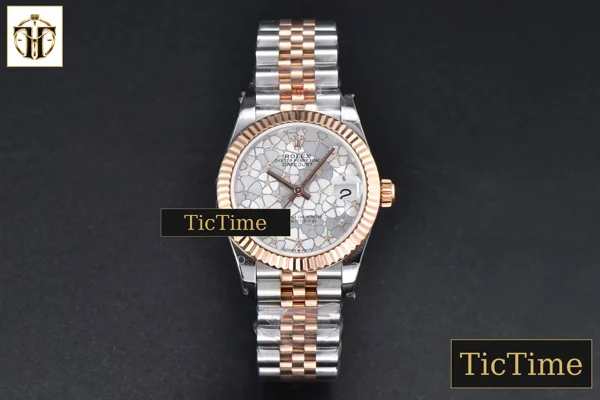 Foto frontal — DateJust 904L 31mm GMF RG/SS Fluted Bezel Silver Flowers Dial Jubilee Bracelet A2824