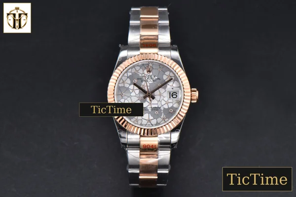 Foto frontal — DateJust 904L 31mm GMF RG/SS Fluted Bezel Silver Flowers Dial Oyster Bracelet A2824